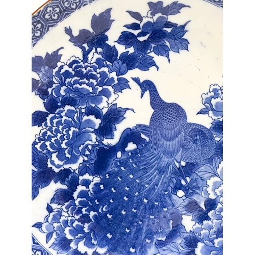 163 - A very large 19th Century Japanese Arita blue and white charger. Meiji Period (1868-1912) 45x5.5cm