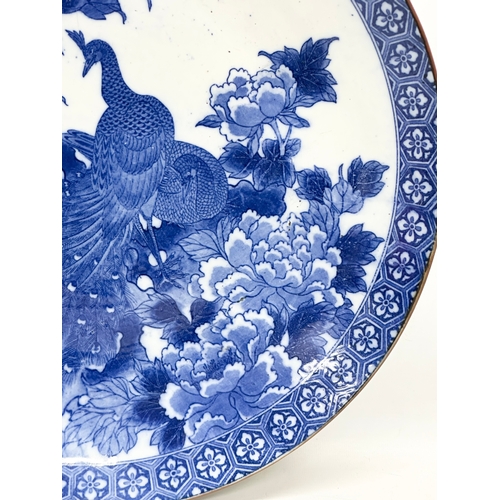 163 - A very large 19th Century Japanese Arita blue and white charger. Meiji Period (1868-1912) 45x5.5cm