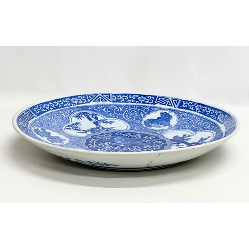 164 - A very large Late 19th/Early 20th Century Japanese Arita blue and white charger. Meiji Period (1868-... 