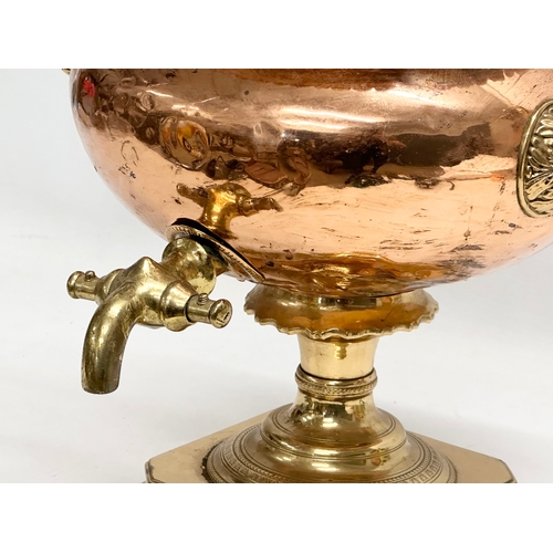 202 - A 19th Century Early Victorian copper and brass samovar. 40x34x42cm.