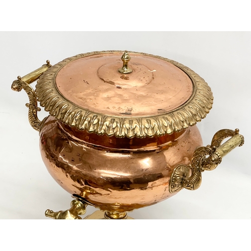 202 - A 19th Century Early Victorian copper and brass samovar. 40x34x42cm.