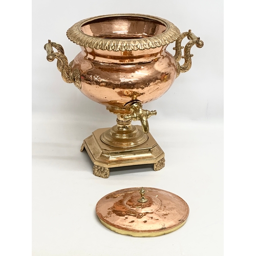 202 - A 19th Century Early Victorian copper and brass samovar. 40x34x42cm.