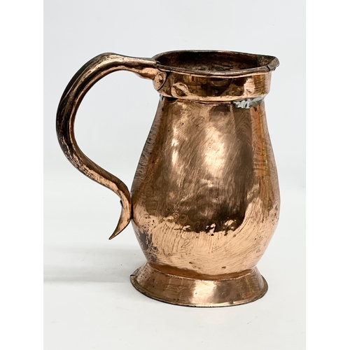 205 - An Early/Mid 19th Century copper measuring jug. 1820-1850. 26x17x26cm.