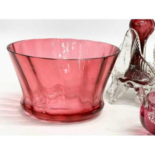 210 - A collection of 19th Century cranberry and ruby glass. A pair of Late 19th Century Bohemian ruby gla... 