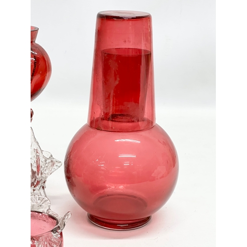 210 - A collection of 19th Century cranberry and ruby glass. A pair of Late 19th Century Bohemian ruby gla... 