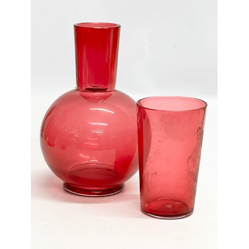 210 - A collection of 19th Century cranberry and ruby glass. A pair of Late 19th Century Bohemian ruby gla... 