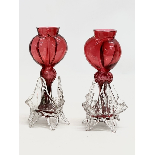 210 - A collection of 19th Century cranberry and ruby glass. A pair of Late 19th Century Bohemian ruby gla... 