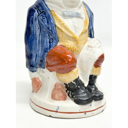 254 - A Late 19th Century Staffordshire Pottery ‘John Bull’ toby jug. 24cm.