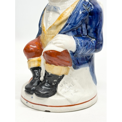 254 - A Late 19th Century Staffordshire Pottery ‘John Bull’ toby jug. 24cm.