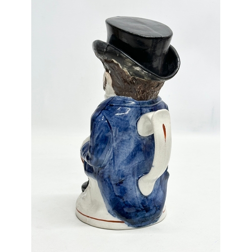 254 - A Late 19th Century Staffordshire Pottery ‘John Bull’ toby jug. 24cm.