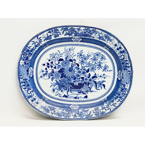 256 - An Early 19th Century English blue and white meat platter. 47x39cm.