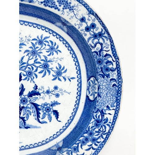 256 - An Early 19th Century English blue and white meat platter. 47x39cm.