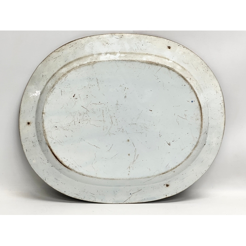 256 - An Early 19th Century English blue and white meat platter. 47x39cm.