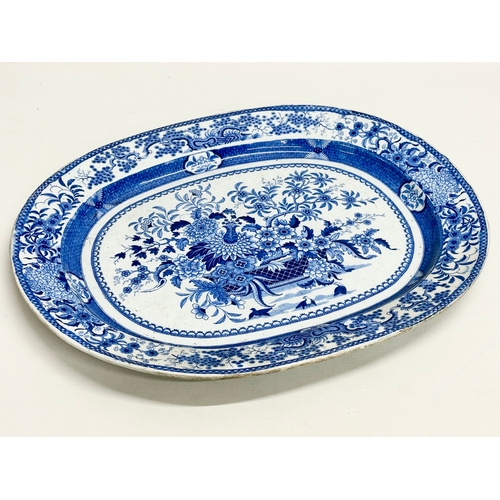 256 - An Early 19th Century English blue and white meat platter. 47x39cm.