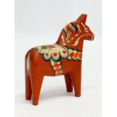 238 - A Swedish wooden Dala horse. Akta Dolahemsloid. 13x14cm.