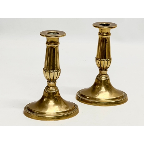 445 - A pair of Mid 20th Century Georgian style brass candlesticks. 10.5x20.5cm.