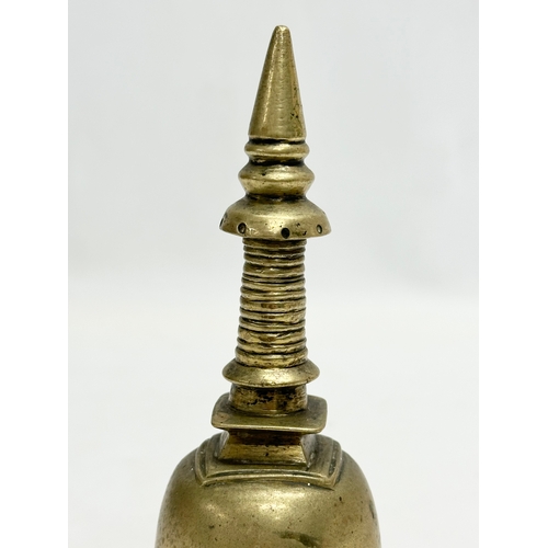 168 - A 19th Century brass Stupa style bell. 16cm