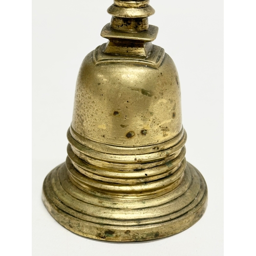 168 - A 19th Century brass Stupa style bell. 16cm