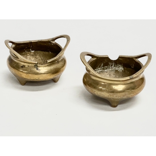 169 - A pair of small Early 20th Century Chinese brass tripod censers. Emperor Xuande seal mark. 7x6.5x5cm... 