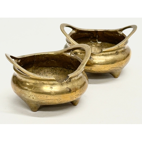 169 - A pair of small Early 20th Century Chinese brass tripod censers. Emperor Xuande seal mark. 7x6.5x5cm... 