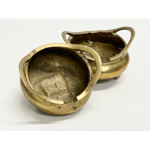 169 - A pair of small Early 20th Century Chinese brass tripod censers. Emperor Xuande seal mark. 7x6.5x5cm... 