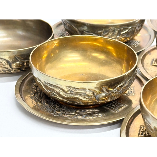 170 - A 12 piece Early/Mid 20th Century Chinese brass bowls and saucers. With embossed seal marks and drag... 