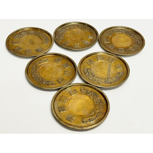 170 - A 12 piece Early/Mid 20th Century Chinese brass bowls and saucers. With embossed seal marks and drag... 