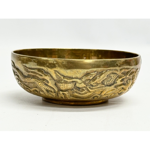 170 - A 12 piece Early/Mid 20th Century Chinese brass bowls and saucers. With embossed seal marks and drag... 