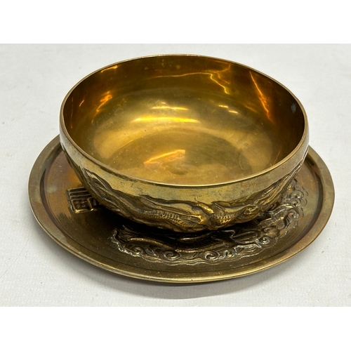 170 - A 12 piece Early/Mid 20th Century Chinese brass bowls and saucers. With embossed seal marks and drag... 