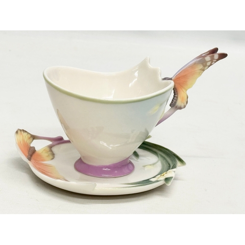 179 - A set of Franz porcelain ‘Papillon Butterfly’ cups and saucers.