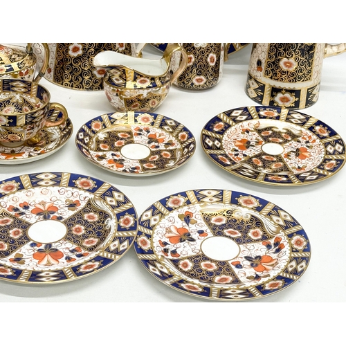 239 - A 19th Century Imari porcelain tea service. Red Crown Mark. Davenport/Derby. 16 pieces.