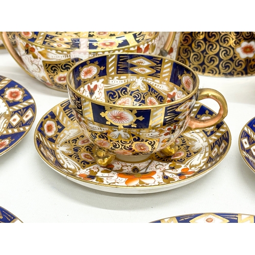 239 - A 19th Century Imari porcelain tea service. Red Crown Mark. Davenport/Derby. 16 pieces.