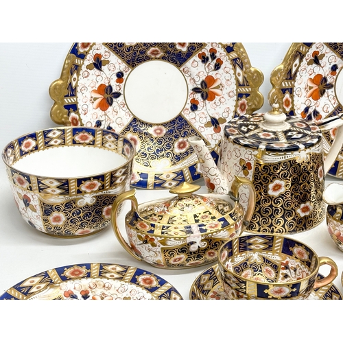 239 - A 19th Century Imari porcelain tea service. Red Crown Mark. Davenport/Derby. 16 pieces.