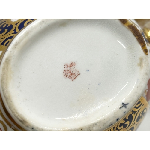 239 - A 19th Century Imari porcelain tea service. Red Crown Mark. Davenport/Derby. 16 pieces.