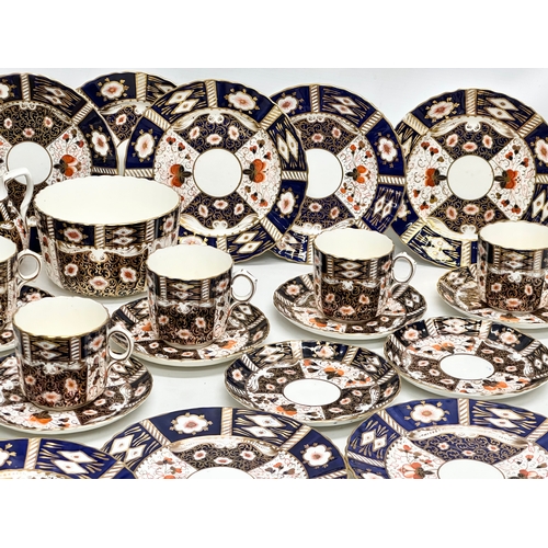 240 - A 32 piece 19th/Early 20th Century Imari pattern tea service. Red Crown and 2 Swords Mark.