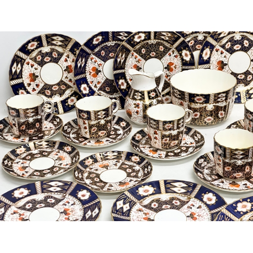 240 - A 32 piece 19th/Early 20th Century Imari pattern tea service. Red Crown and 2 Swords Mark.