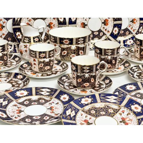 240 - A 32 piece 19th/Early 20th Century Imari pattern tea service. Red Crown and 2 Swords Mark.