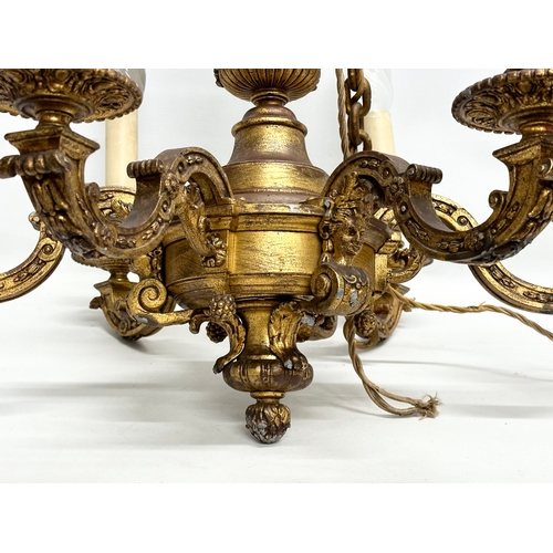 9 - An excellent quality gilt bronze Early 20th Century chandelier. 62x55cm. 102cm including chain.