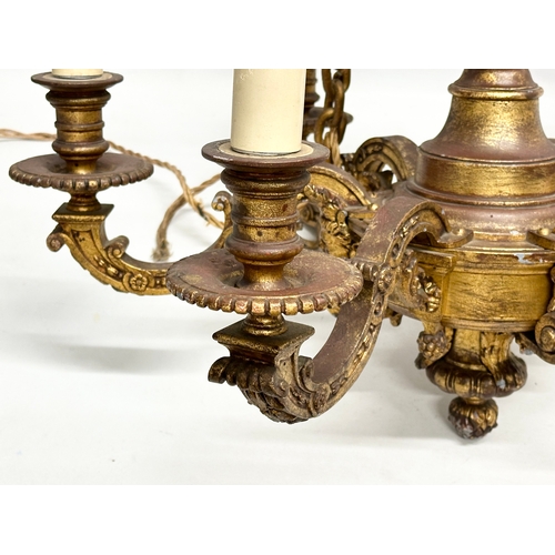 9 - An excellent quality gilt bronze Early 20th Century chandelier. 62x55cm. 102cm including chain.