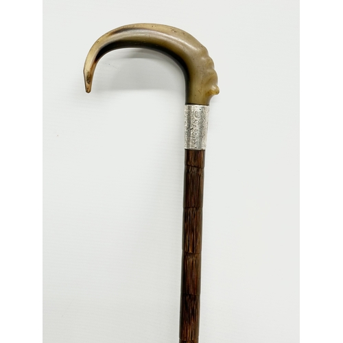 129 - A 19th Century Victorian silver mounted and horn handled walking stick. 92cm