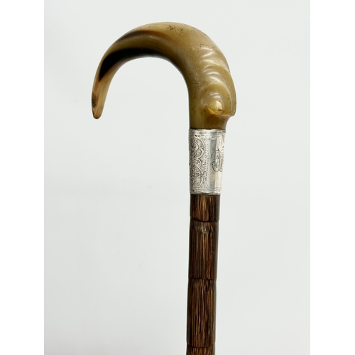 129 - A 19th Century Victorian silver mounted and horn handled walking stick. 92cm