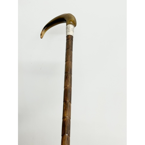 129 - A 19th Century Victorian silver mounted and horn handled walking stick. 92cm