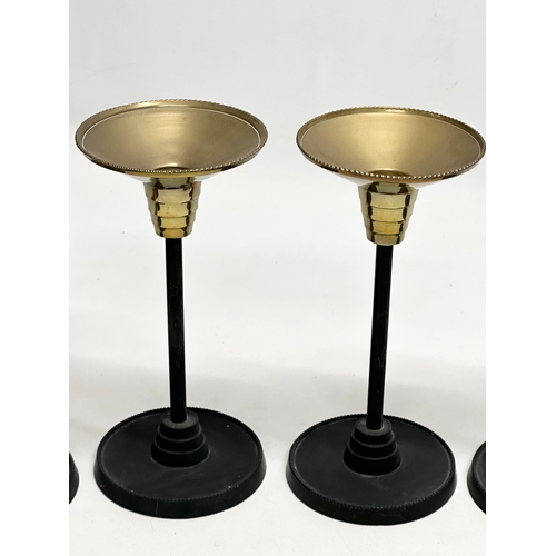 301 - A set of 6 Art Deco style candlesticks. 23.5cm. 18.5cm. 13.5cm.