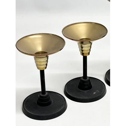 301 - A set of 6 Art Deco style candlesticks. 23.5cm. 18.5cm. 13.5cm.