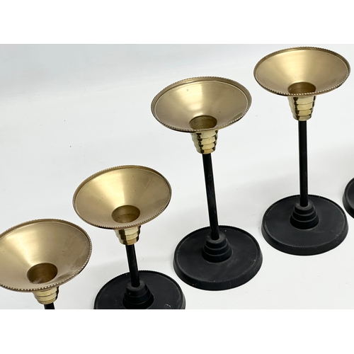 301 - A set of 6 Art Deco style candlesticks. 23.5cm. 18.5cm. 13.5cm.