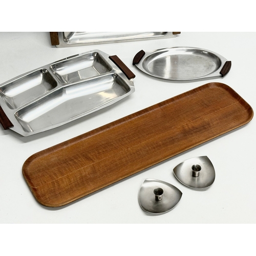 229 - A collection of Mid Century teak and stainless steel. Mid Century candleholders, Special Teak tray 5... 