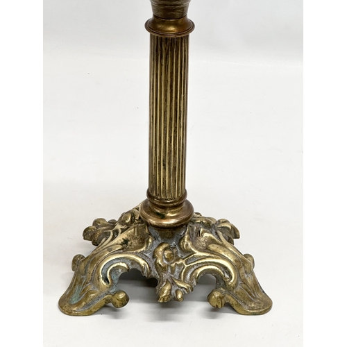 272 - A tall 19th Century Victorian double burner oil lamp. With reeded brass column and glass bowl. 67cm