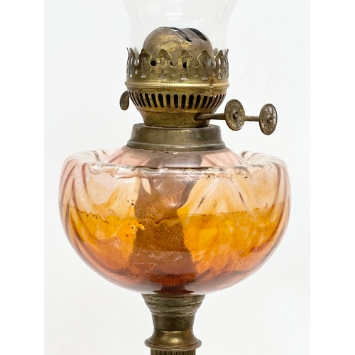 272 - A tall 19th Century Victorian double burner oil lamp. With reeded brass column and glass bowl. 67cm