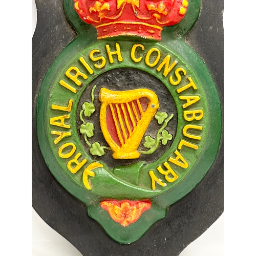 428 - A large Mid/Late 20th Century reproduction Royal Irish Constabulary wall plaque. 29x50cm