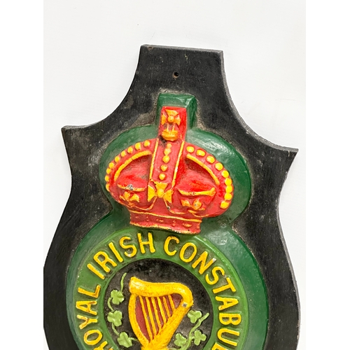 428 - A large Mid/Late 20th Century reproduction Royal Irish Constabulary wall plaque. 29x50cm